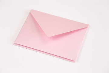 Stack of light pink open envelope on white isolated background. Two envelopes for invitations,...