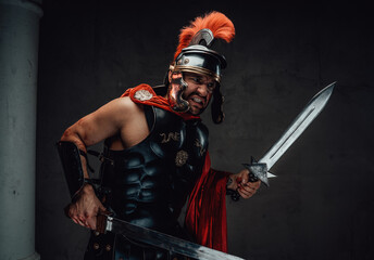 Fototapeta na wymiar Angry armoured roman soldier with dual swords attacks
