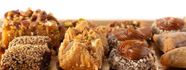 Assortment of Ramadan dessert baklava isolated on white background
