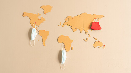 
horizontal image of world map made of cork pasted on the wall of the living room