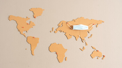 
horizontal image of world map made of cork pasted on the wall of the living room