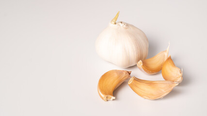 Garlic isolated on white background. Raw garlic segment isolated with copy space. White garlic head