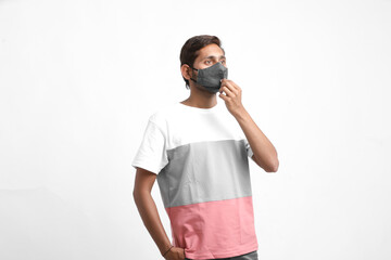 Young asian man wearing medical mask on white background. Coronavirus or covid-19 protection concept.