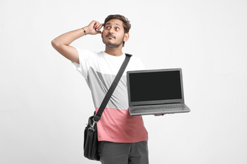 Indian college student showing laptop screen on white background.