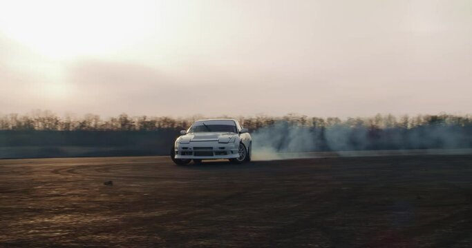 Fast vehicle drifting in evening