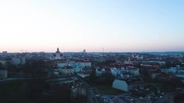 Vilnius Old Town after sunset. Aerial wide shot of beautiful cityscape.