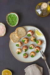 Escargots de Bourgogne. Snails with herbs butter. Healty eating. French food.