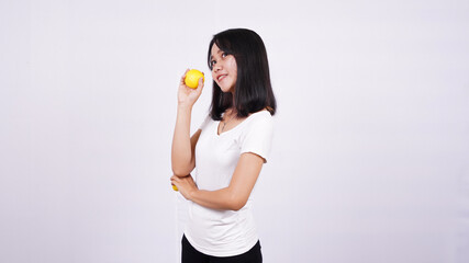 beautiful asian women thinking with a lemon isolated on white background