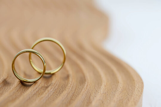 Premium Photo  Wedding ring invitation on wood background