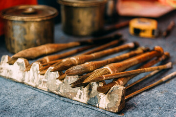 A brush covered with gold lacquer on the pen holder. Stationery for calligraphy, chinese traditonal art. Tool for writhing spring couplet.