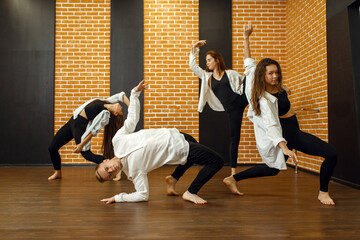 Contemporary dance group poses in studio
