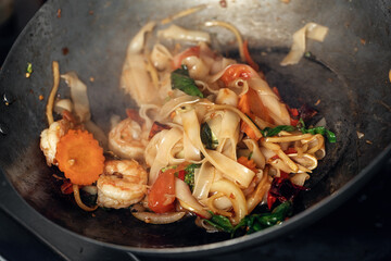 steaming mixed vegetables in the wok, asian style cooking vegetarian and healthy, selected focus.