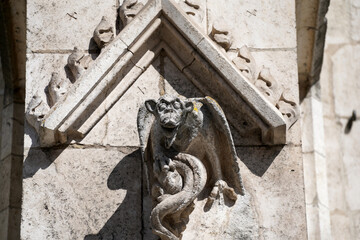 Fototapeta na wymiar Lime sandstone gargoyles at St. Peter's Cathedral in Regensburg, photographed in spring