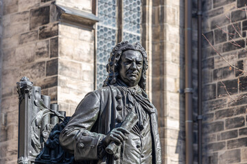 Leipzig, Saxony, Germany, 03-31-2021 Monument to the Thomaskantor and composer Johann Sebastian Bach in front of the Thomaskirche