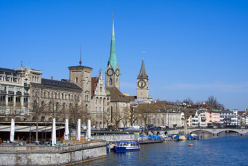 Naklejka na ściany i meble Old town of Zurich with churches Fraumünster (German), translation is Women's Minster, and St. Peter. Photo taken April 1st, 2021.