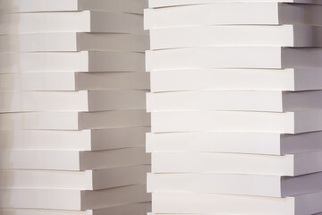 A stack of blank paper in a printing warehouse