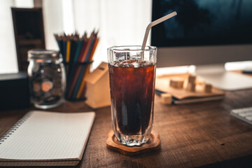 Iced coffee in a mug on the desk