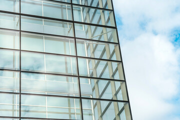 Obraz premium Modern business building with glass windows, skyscrapers in a finance district