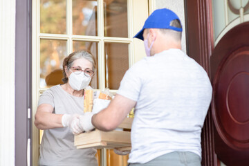 Delivering food to senior woman during quarantine Coronavirus (Covid-19) epidemic