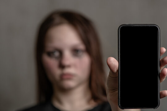 Unhappy girl shows smartphone with empty screen