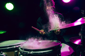 Drummer's rehearsing on drums before rock concert. Man recording music on drumset in studio