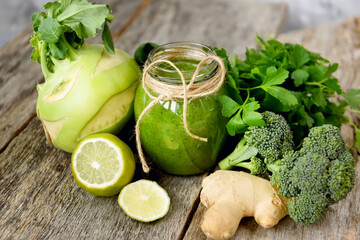 green smoothie and green vegetables and herbs.