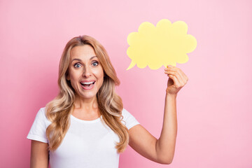 Photo of clever sociable lady hold thought bubble empty space wear white t-shirt isolated pink...
