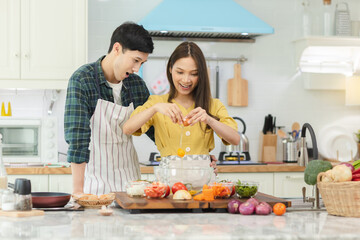 A couple breaks an egg to make a morning omelet at home. Romantic time For a newly married couple.