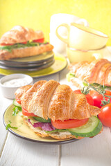 Croissant sandwich with fresh vegetables