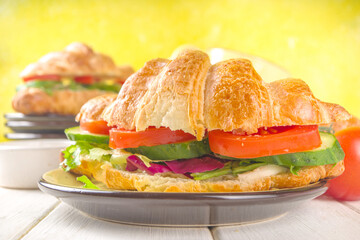 Croissant sandwich with fresh vegetables