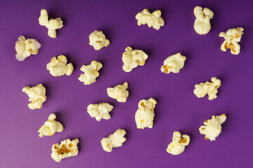 cooked popcorn on a violet . Leisure concept