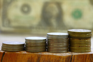 Stacking coins on the table Business growth for saving money and financial concept