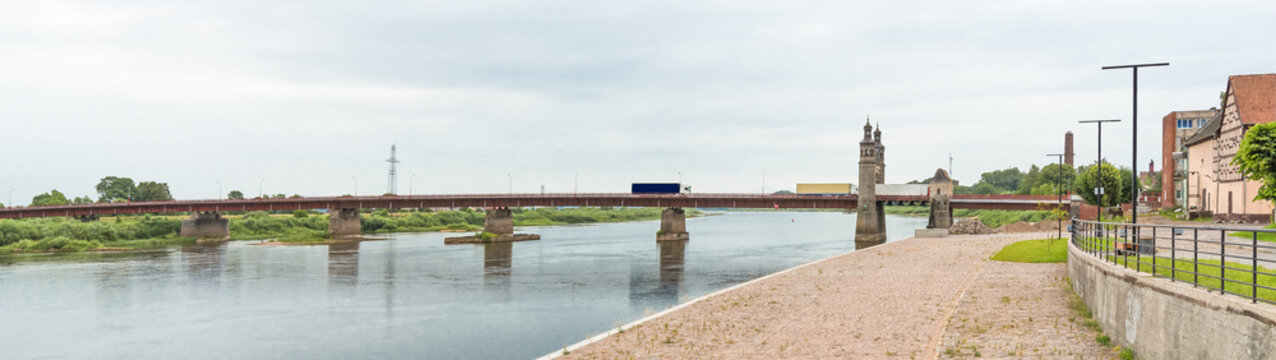 The Neman River, along which the Russian-Lithuanian border passes, in the city of Sovetsk, Russia. Border crossing point on the Queen Louise Bridge. In the background, the ruins of Tilsit Castle