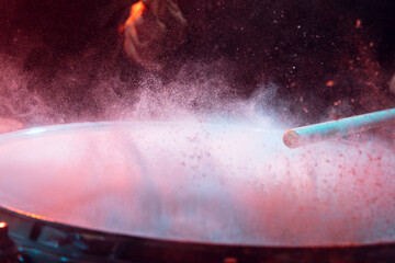 Drummer's rehearsing on drums before rock concert. Man recording music on drumset in studio