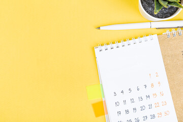 closing month calendar for 2021 on yellow background, planning a business meeting or travel...