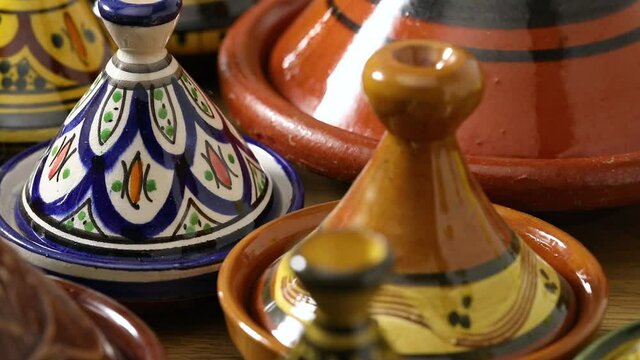 Collection of traditional colorful decorated Moroccan ceramic tajines 
