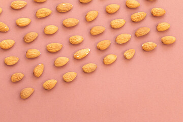 group of nuts on brown background, healthy food concept, empty space for text
