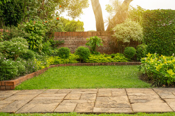 Back - front yard English cottage garden, green grass lawn, colorful flowering plant - obrazy, fototapety, plakaty