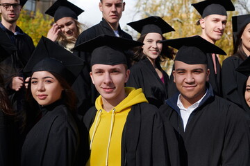 Group of diverse international graduating students celebrating