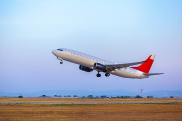 Passenger plane takes off from runway in airport