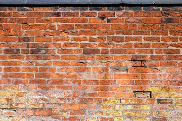 Aged red brick Victorian wall