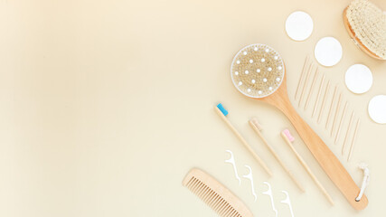 Body or face care concept. Beauty treatments at home or in the salon. Minimal flat lay over beige background.brush for dry massage,toothbrush,hair brush. Top view,flat lay. Place for text.