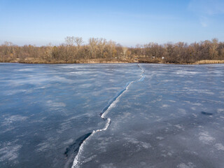 Crack of ice on the river. Aerial drone view.