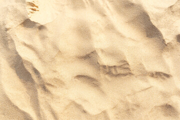Sand on the beach as background. Light beige sea sand texture pattern, sandy beach background.