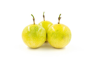 Closeup of multiple fresh golden passion fruit isolated on white background