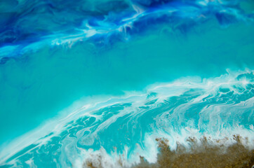 Epoxy resin art. Imitation of the sea. Sea foam. Modern trendy hobby. Macro photo