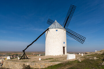 Fototapeta na wymiar traditional whitewashed Spanish windmills in La Mancha on a hilltop above Consuegra