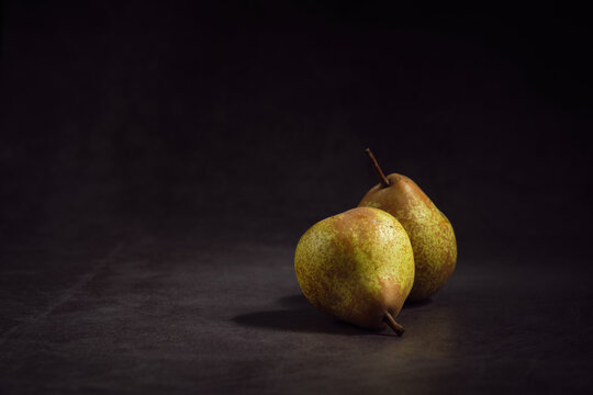 pears on a dark background