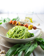 Pesto spaghetti with grilled tomatoes