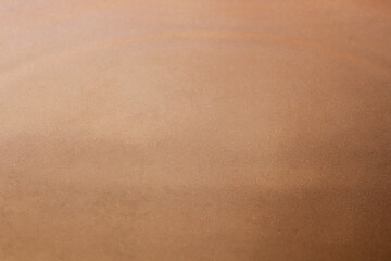 The shallow inhomogeneous structure of the sand through the smooth surface of the water